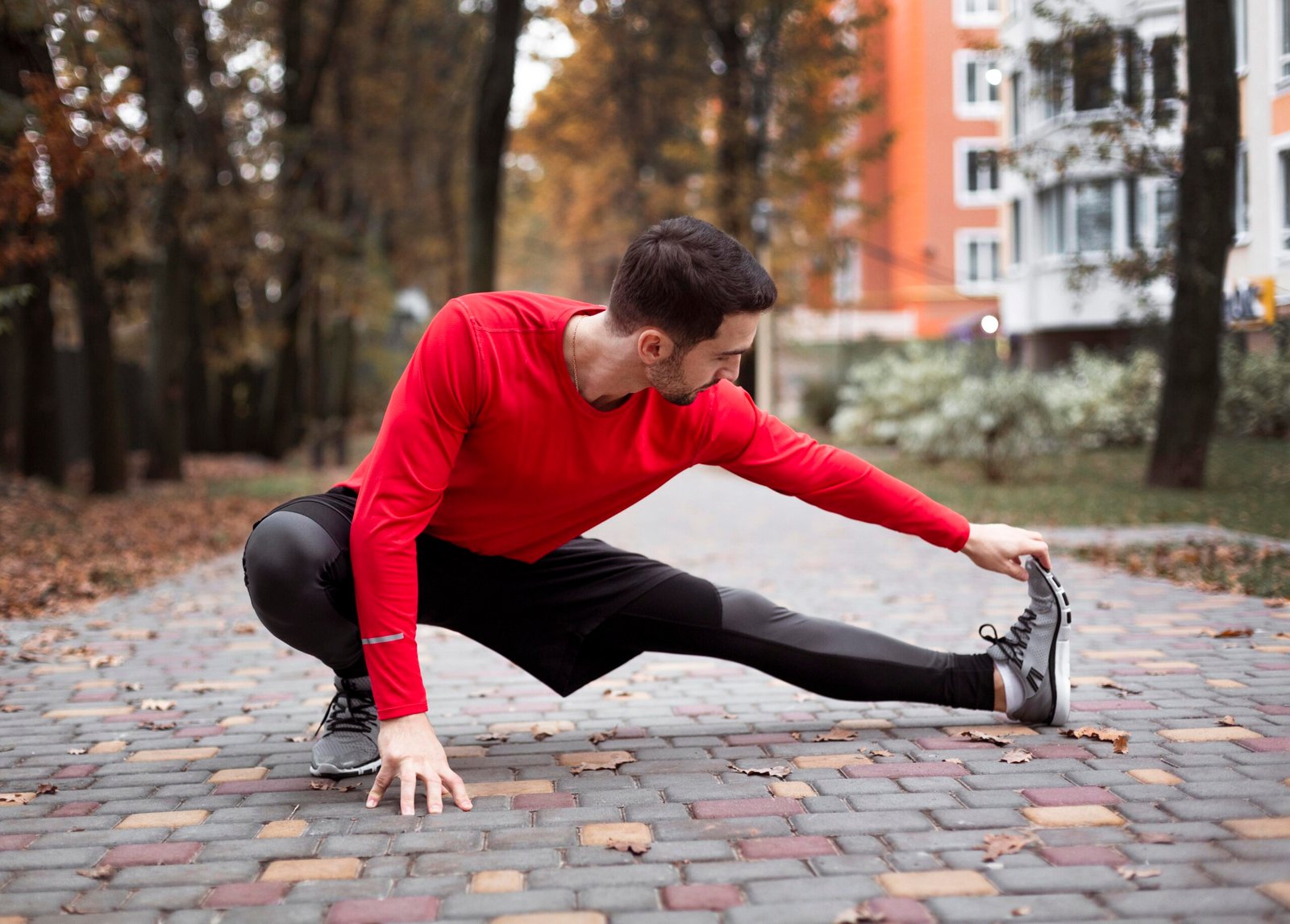 full-shot-man-stretching-outdoors